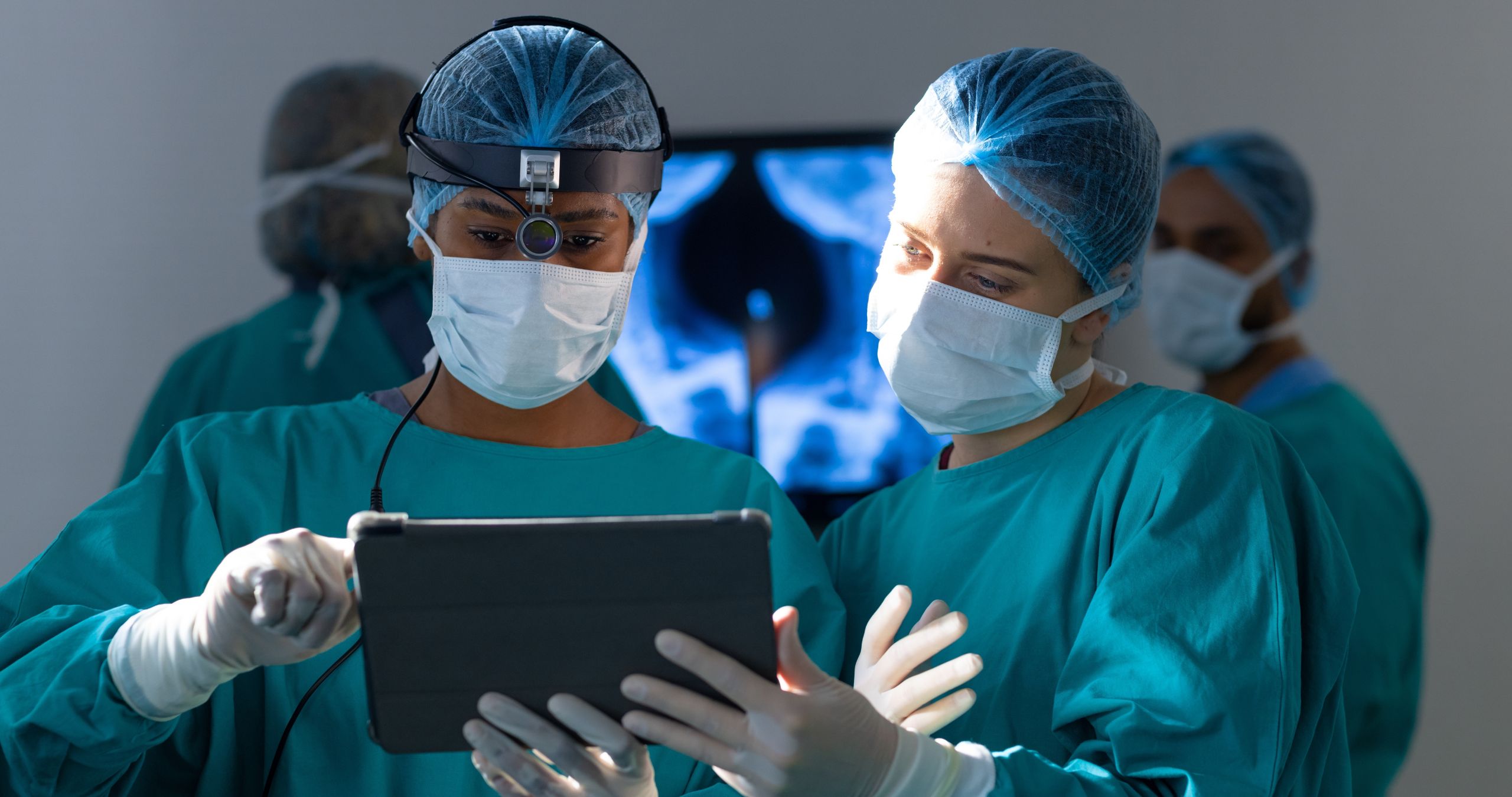 Neuromonitoring technologist reviewing intraoperative waveform data