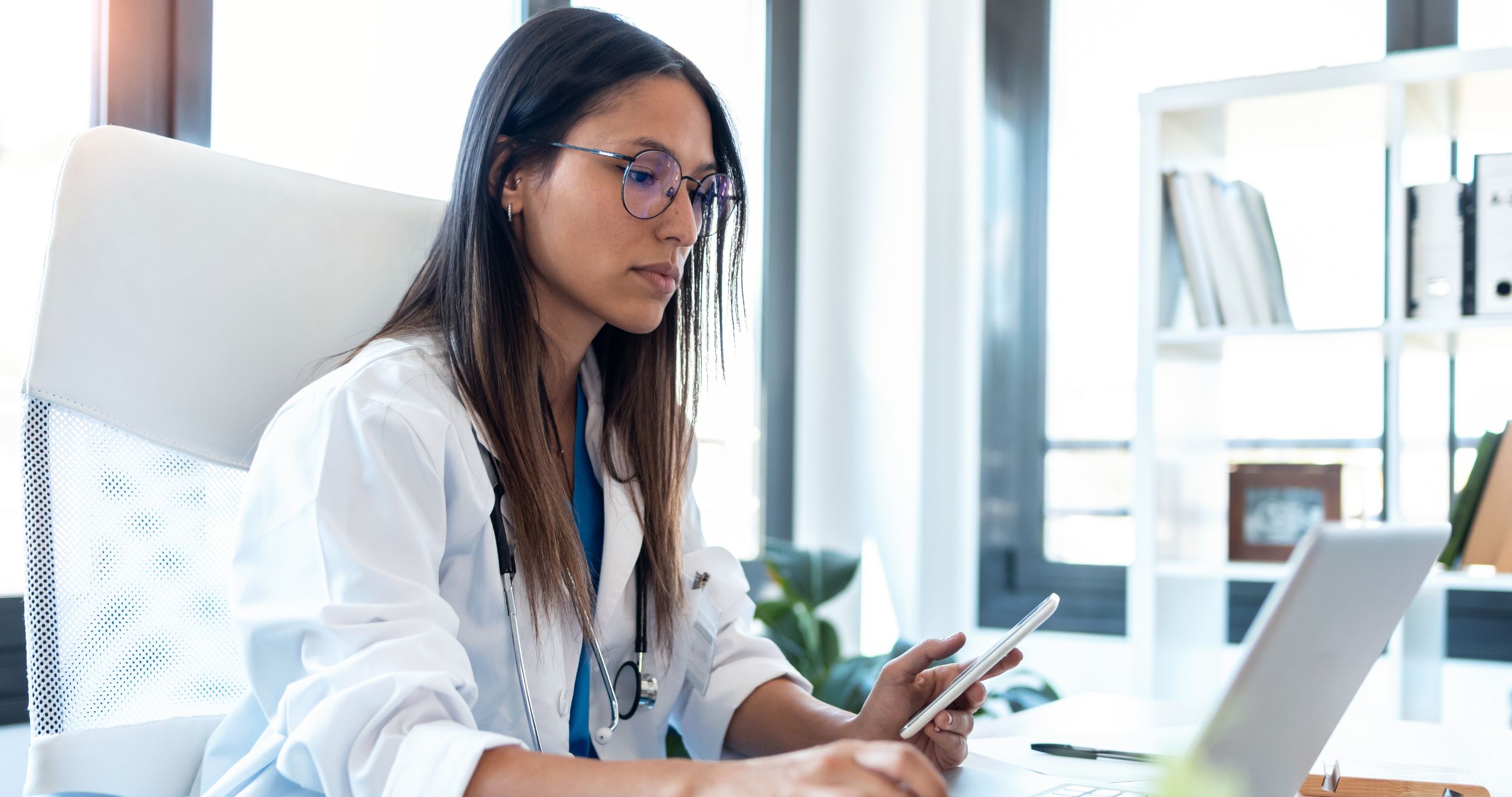Clinician reviewing accreditation and quality documentation